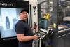  – Ruud Stokmans at one of the six DMG&nbsp;MORI machining centers connected to the Hummingbird MES&nbsp;system. Tool data is transferred digitally to the machine with no manual entry required.